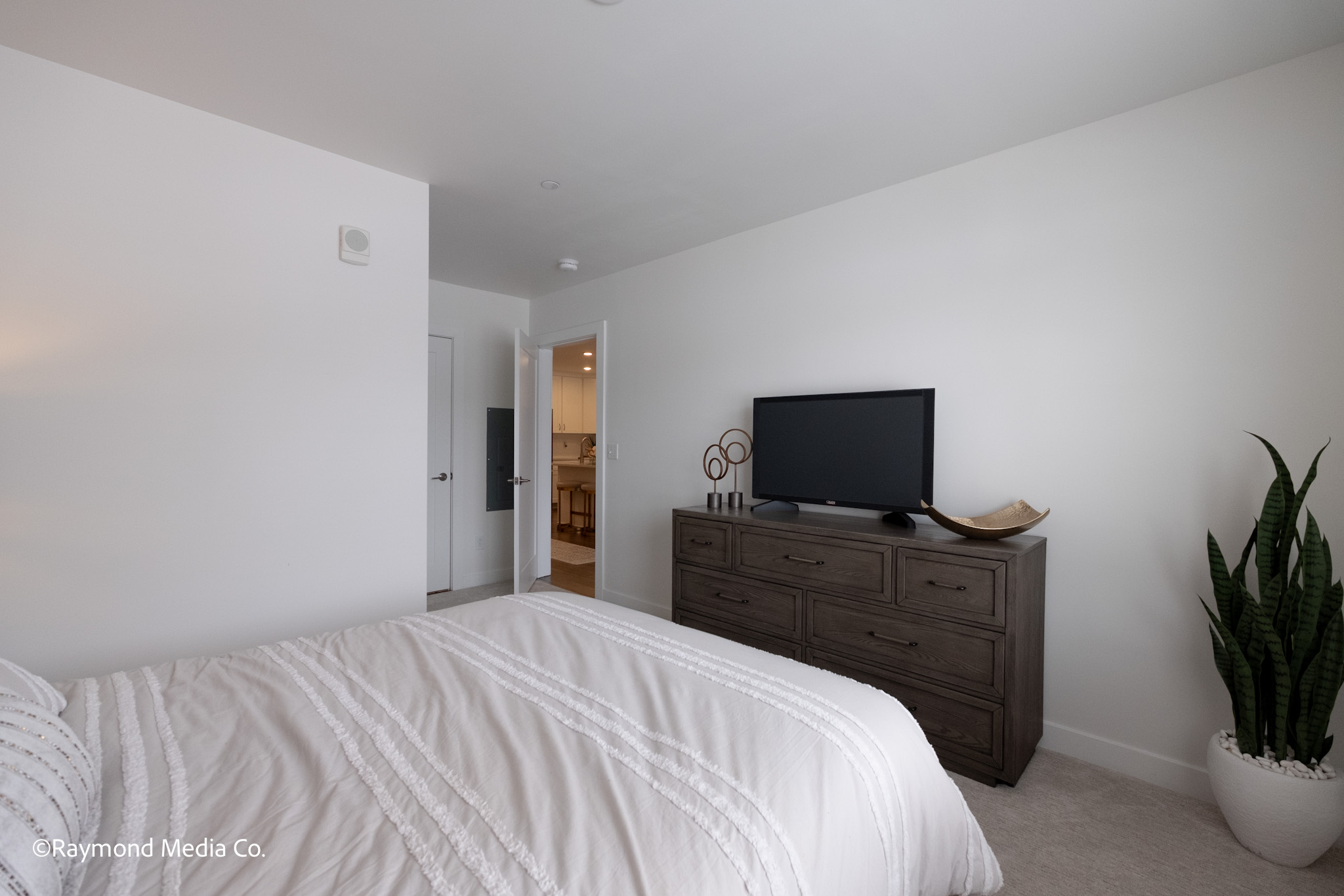 Apartment bedroom depth perspective showing doorway and layout
