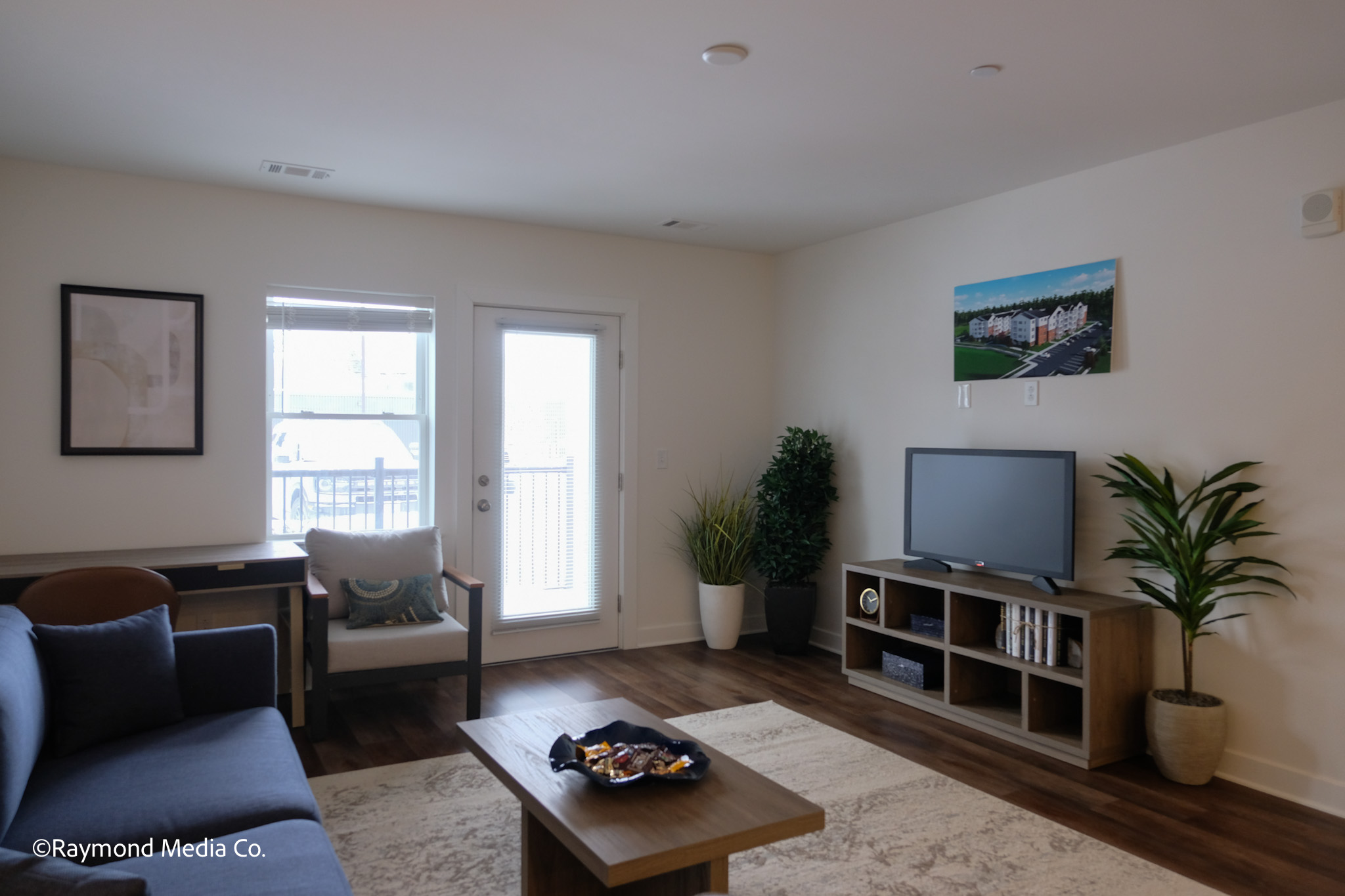 Open concept apartment living space photographed in Maine